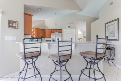 Welcome to your dream home! Nestled on a prestigious Viera East on Viera East Golf Club in Florida - for sale on GolfHomes.com, golf home, golf lot