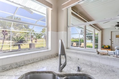 Welcome to your dream home! Nestled on a prestigious Viera East on Viera East Golf Club in Florida - for sale on GolfHomes.com, golf home, golf lot