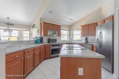 Welcome to your dream home! Nestled on a prestigious Viera East on Viera East Golf Club in Florida - for sale on GolfHomes.com, golf home, golf lot
