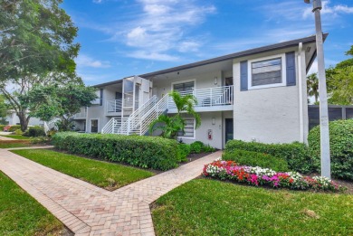 Beautifully updated second-floor, two-bedroom, two-bath on Hunters Run Golf and Country Club in Florida - for sale on GolfHomes.com, golf home, golf lot