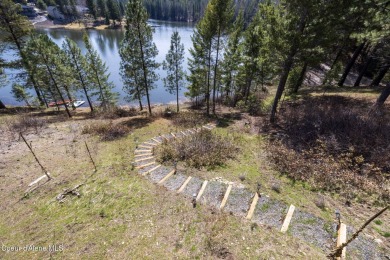 Perched on the peaceful shores of Sans Souci Lake, this on Stoneridge Golf Club in Idaho - for sale on GolfHomes.com, golf home, golf lot