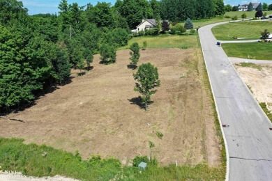 Are you looking to build your dream home with views of Grand on Lochen Heath Golf Course in Michigan - for sale on GolfHomes.com, golf home, golf lot