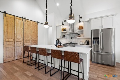 This stunning property offers a perfect blend of tranquility and on Slick Rock Golf Course - Horseshoe Bay in Texas - for sale on GolfHomes.com, golf home, golf lot