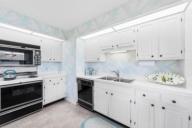 Discover exceptional potential in this meticulously maintained on Quail Ridge Golf Course and Country Club in Florida - for sale on GolfHomes.com, golf home, golf lot