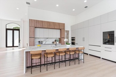 RARELY AVAILABLE COMPLETELY REMODELED CONTEMPORARY SINGLE FAMILY on Breakers Rees Jones Course in Florida - for sale on GolfHomes.com, golf home, golf lot