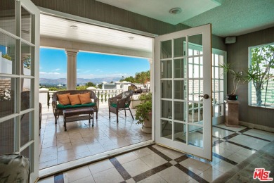 This exceptionally rare two-story view home is on the market for on Woodland Hills Country Club in California - for sale on GolfHomes.com, golf home, golf lot