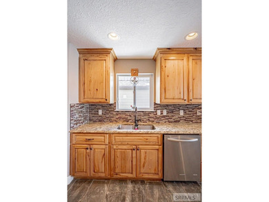 This spacious home offers 4 bedrooms, 3 full bathrooms, and a on  in ID - for sale on GolfHomes.com, golf home, golf lot