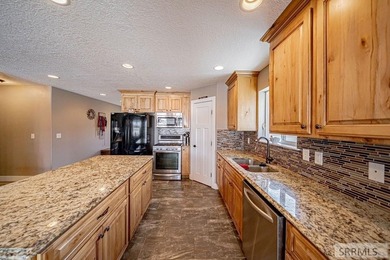 This spacious home offers 4 bedrooms, 3 full bathrooms, and a on  in ID - for sale on GolfHomes.com, golf home, golf lot