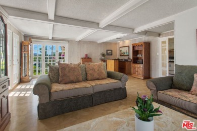 This exceptionally rare two-story view home is on the market for on Woodland Hills Country Club in California - for sale on GolfHomes.com, golf home, golf lot