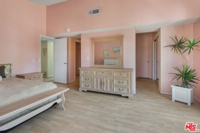 This exceptionally rare two-story view home is on the market for on Woodland Hills Country Club in California - for sale on GolfHomes.com, golf home, golf lot