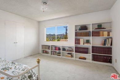 This exceptionally rare two-story view home is on the market for on Woodland Hills Country Club in California - for sale on GolfHomes.com, golf home, golf lot