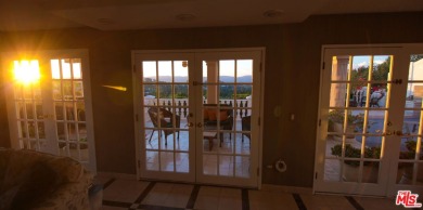 This exceptionally rare two-story view home is on the market for on Woodland Hills Country Club in California - for sale on GolfHomes.com, golf home, golf lot