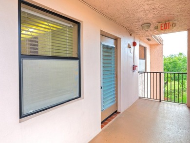 Enjoy stunning lake views from this bright, corner 2-bedroom on Sunrise Lakes Phase IV Golf Course in Florida - for sale on GolfHomes.com, golf home, golf lot