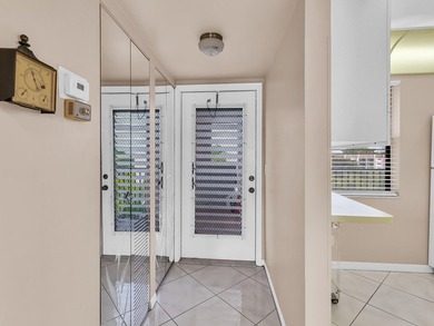 Enjoy stunning lake views from this bright, corner 2-bedroom on Sunrise Lakes Phase IV Golf Course in Florida - for sale on GolfHomes.com, golf home, golf lot