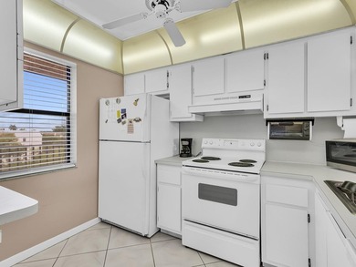 Enjoy stunning lake views from this bright, corner 2-bedroom on Sunrise Lakes Phase IV Golf Course in Florida - for sale on GolfHomes.com, golf home, golf lot