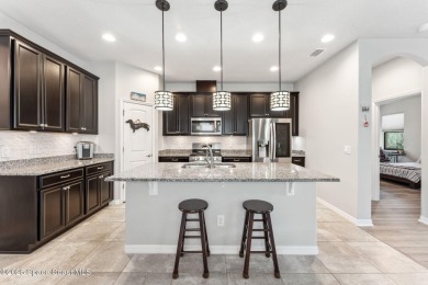 This upgraded Juniper floorplan delivers comfort, style, and on Duran Golf Course in Florida - for sale on GolfHomes.com, golf home, golf lot