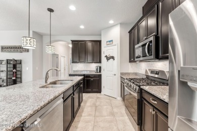 This upgraded Juniper floorplan delivers comfort, style, and on Duran Golf Course in Florida - for sale on GolfHomes.com, golf home, golf lot
