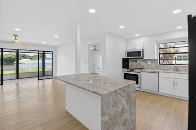 A very rare opportunity to own a first floor waterfront Isle of on Kings Point Golf -Flanders Way in Florida - for sale on GolfHomes.com, golf home, golf lot