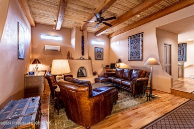 Quintessential Pueblo Revival architecture in Northern New on Pinon Hills Golf Course in New Mexico - for sale on GolfHomes.com, golf home, golf lot