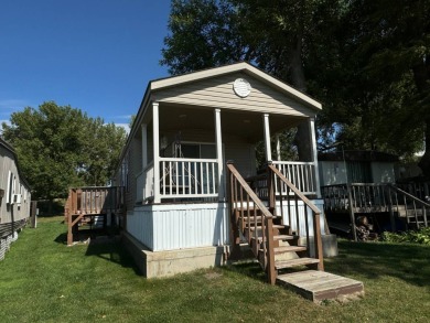 Two-bedroom one bath located on Roy Lake. 2009 14 x 55 mobile on Roy View Golf Course in South Dakota - for sale on GolfHomes.com, golf home, golf lot