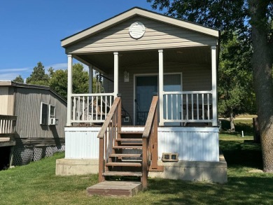 Two-bedroom one bath located on Roy Lake. 2009 14 x 55 mobile on Roy View Golf Course in South Dakota - for sale on GolfHomes.com, golf home, golf lot