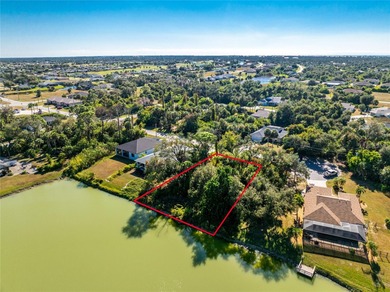 Make your Florida dream come true on this water view lot on a on Rotonda Golf and Country Club The Palms Course in Florida - for sale on GolfHomes.com, golf home, golf lot