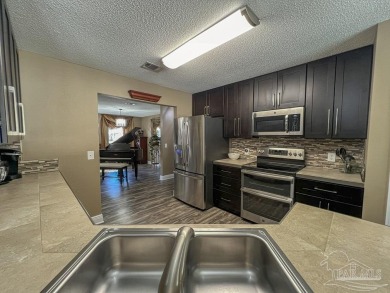**2025 Roof  Water Heater | Saltwater Pool | Golf Community** on Tanglewood Golf Club in Florida - for sale on GolfHomes.com, golf home, golf lot