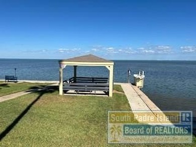Discover the best of coastal living in this ground-floor on South Padre Island Golf Club in Texas - for sale on GolfHomes.com, golf home, golf lot