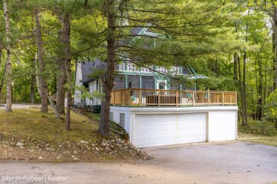 Welcome to this distinctive four-bedroom, three-bath chalet on Canadian Lakes Country Club-The Royal Course in Michigan - for sale on GolfHomes.com, golf home, golf lot