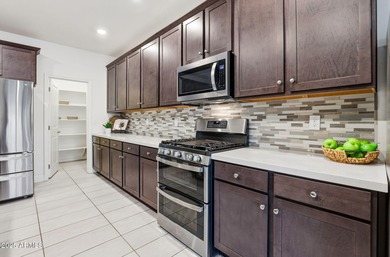 Beautifully upgraded home close to the lakes, yacht club & more on Estrella Mountain Ranch Golf Course in Arizona - for sale on GolfHomes.com, golf home, golf lot