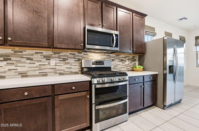 Beautifully upgraded home close to the lakes, yacht club & more on Estrella Mountain Ranch Golf Course in Arizona - for sale on GolfHomes.com, golf home, golf lot