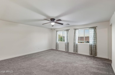 Beautifully upgraded home close to the lakes, yacht club & more on Estrella Mountain Ranch Golf Course in Arizona - for sale on GolfHomes.com, golf home, golf lot