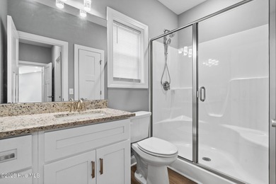 Welcome to your ideal coastal escape! This charming one-story on Sea Trail Golf Resort in North Carolina - for sale on GolfHomes.com, golf home, golf lot