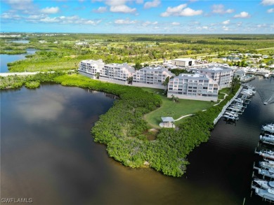 Discover luxury waterfront living in Boca Vista Harbor with this on Coral Creek Club in Florida - for sale on GolfHomes.com, golf home, golf lot