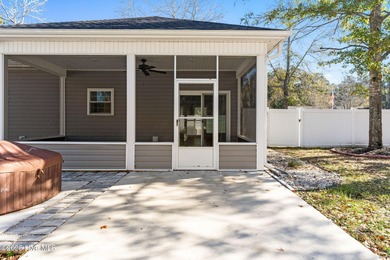 Welcome to your ideal coastal escape! This charming one-story on Sea Trail Golf Resort in North Carolina - for sale on GolfHomes.com, golf home, golf lot