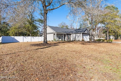 Welcome to your ideal coastal escape! This charming one-story on Sea Trail Golf Resort in North Carolina - for sale on GolfHomes.com, golf home, golf lot