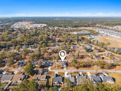 Welcome to your ideal coastal escape! This charming one-story on Sea Trail Golf Resort in North Carolina - for sale on GolfHomes.com, golf home, golf lot