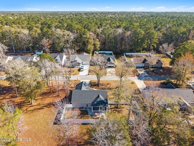 Welcome to your ideal coastal escape! This charming one-story on Sea Trail Golf Resort in North Carolina - for sale on GolfHomes.com, golf home, golf lot