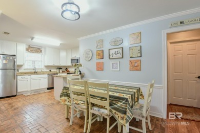 This charming single-story cottage features 3 bedrooms and 2 on Lake Forest Yacht and Country Club in Alabama - for sale on GolfHomes.com, golf home, golf lot