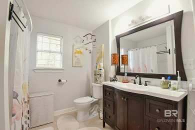 This charming single-story cottage features 3 bedrooms and 2 on Lake Forest Yacht and Country Club in Alabama - for sale on GolfHomes.com, golf home, golf lot