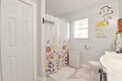 This charming single-story cottage features 3 bedrooms and 2 on Lake Forest Yacht and Country Club in Alabama - for sale on GolfHomes.com, golf home, golf lot