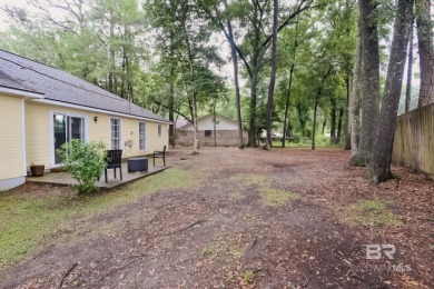 This charming single-story cottage features 3 bedrooms and 2 on Lake Forest Yacht and Country Club in Alabama - for sale on GolfHomes.com, golf home, golf lot