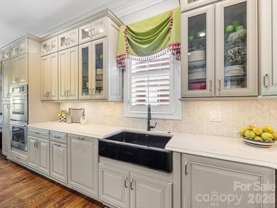 This beautiful home is a hidden gem in the gated community of on Carmel Country Club in North Carolina - for sale on GolfHomes.com, golf home, golf lot