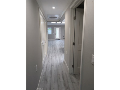 The minute you walk into this gorgeous re-designed three-bedroom on Laguna Woods Village Golf Course in California - for sale on GolfHomes.com, golf home, golf lot