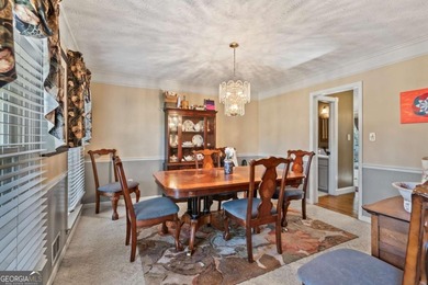 Welcome home to this beautiful contemporary home, spread out on on Canongate At Georgia National Golf Club in Georgia - for sale on GolfHomes.com, golf home, golf lot