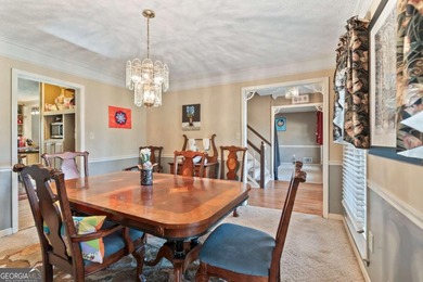 Welcome home to this beautiful contemporary home, spread out on on Canongate At Georgia National Golf Club in Georgia - for sale on GolfHomes.com, golf home, golf lot