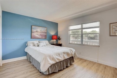Enjoy resort-style living in Wynmoor's sought-after Antigua I on Wynmoor Golf Course in Florida - for sale on GolfHomes.com, golf home, golf lot