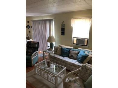 Cozy cottage with open floor plan and beachy feel.  Fully on Captains Cove Golf and Yacht Club in Virginia - for sale on GolfHomes.com, golf home, golf lot