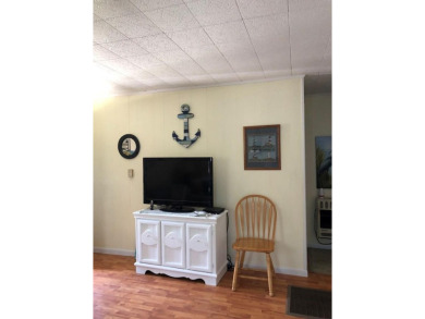 Cozy cottage with open floor plan and beachy feel.  Fully on Captains Cove Golf and Yacht Club in Virginia - for sale on GolfHomes.com, golf home, golf lot