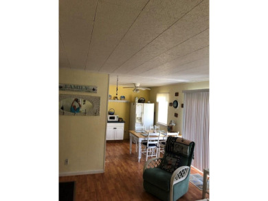 Cozy cottage with open floor plan and beachy feel.  Fully on Captains Cove Golf and Yacht Club in Virginia - for sale on GolfHomes.com, golf home, golf lot